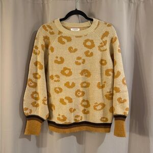 Andree Mango Cream and Orange Crew Neck Sweater with Retro Floral Design
